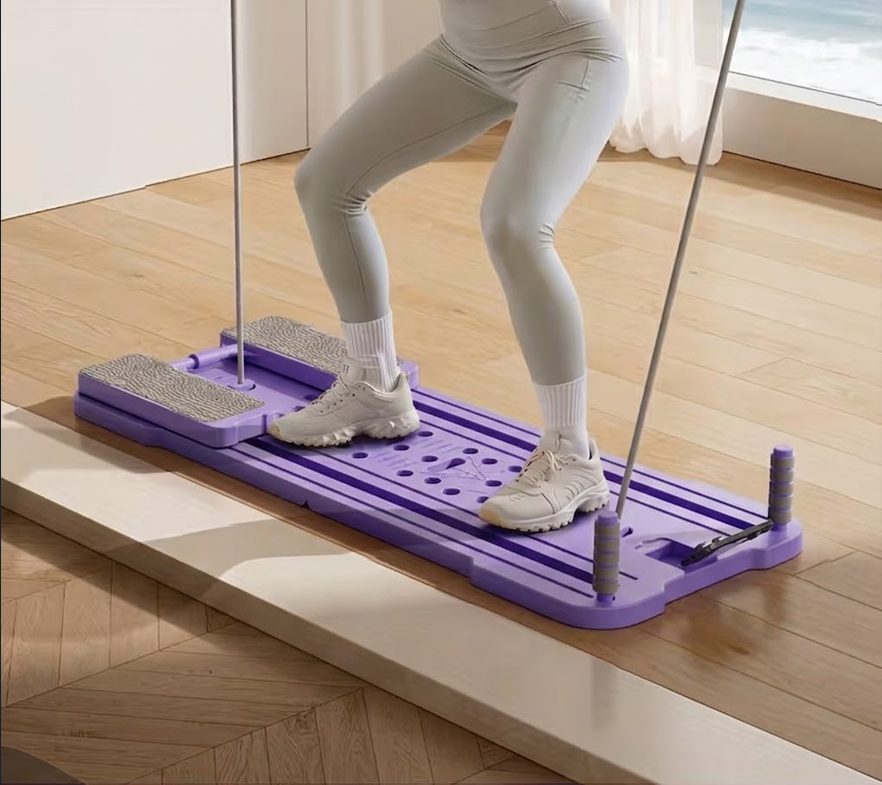 Split Pilates Ab Board shown open with handles and resistance accessories